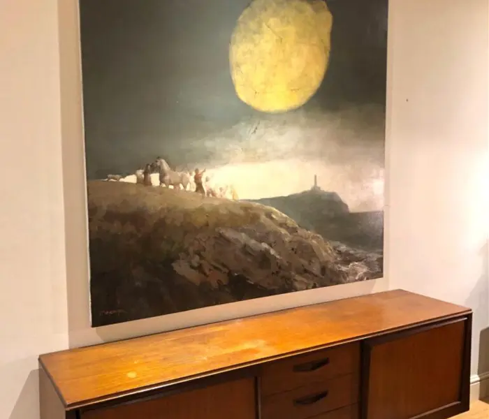 Precision gallery wall installation with multiple photo frames in a Finchley living room